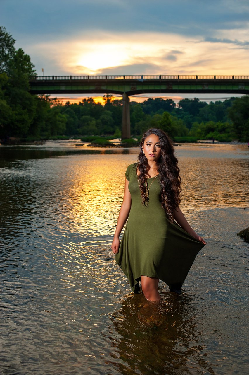 Senior girl in river at sunset portrait session