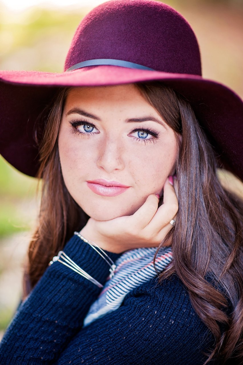 Senior girl portrait wearing purple hat posing idea