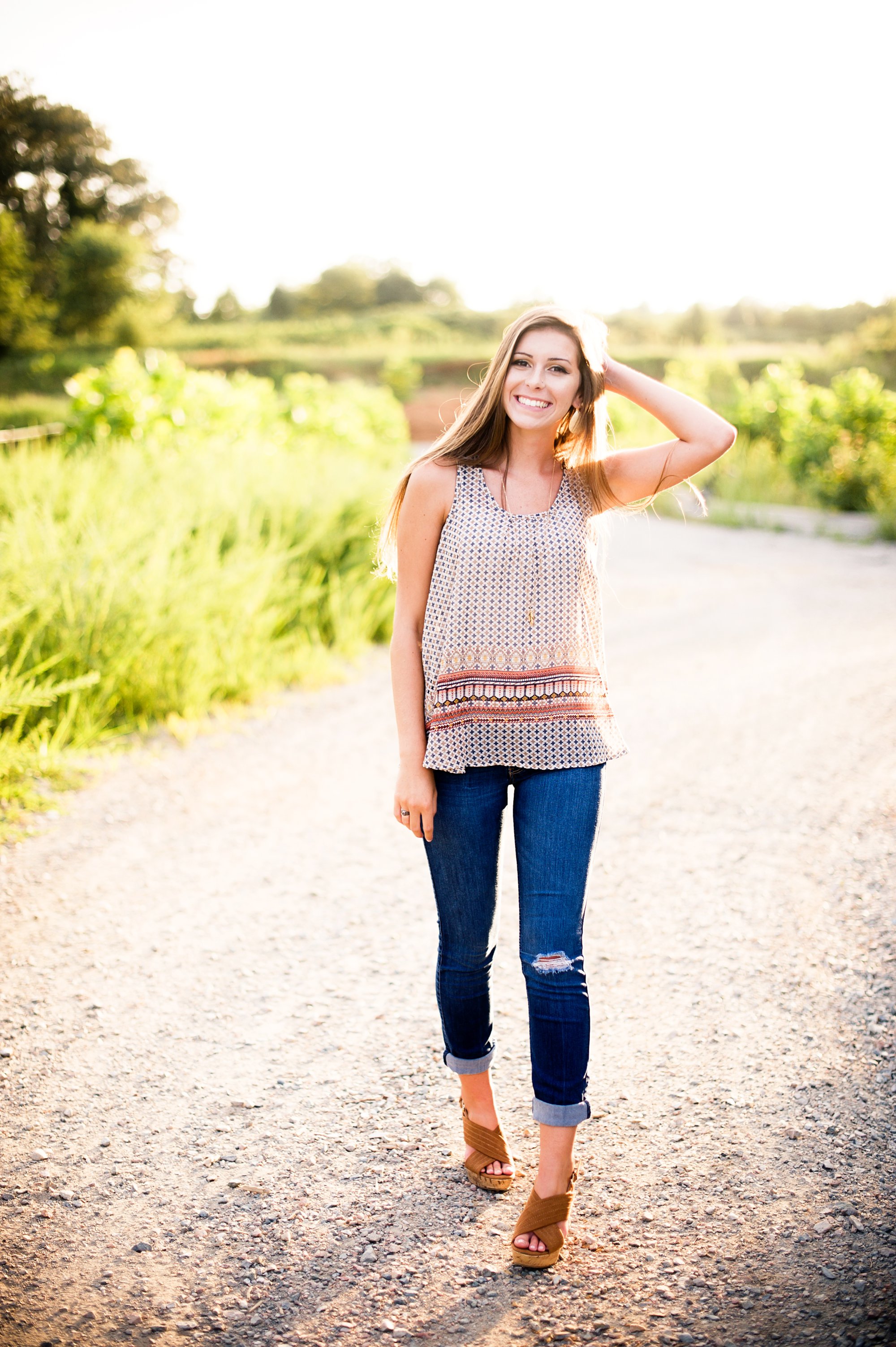 richmond senior girl pictures on dirt road at sunset with gorgeous back lights