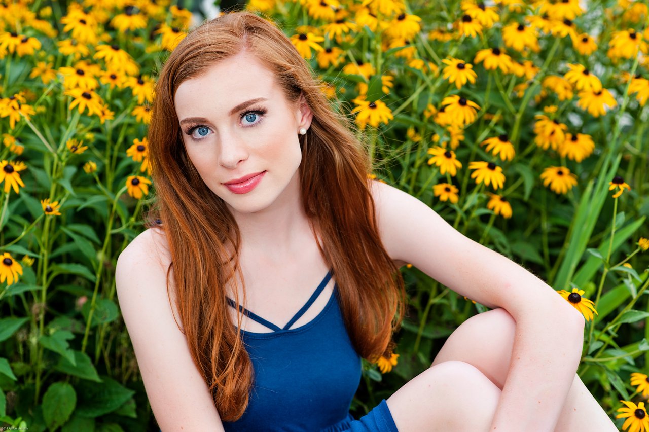 red head high school senior portraits with yellow flowers
